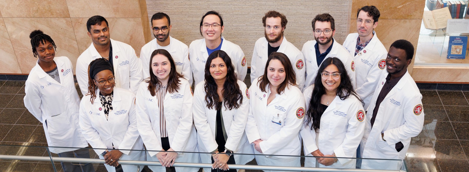 Current PhD in Neuroscience students standing in front of the Translational Research Center.